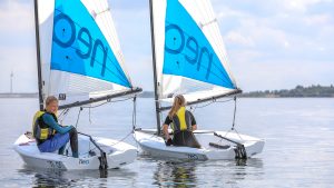 Two RS Neo Sailing boats with children learning to sail.